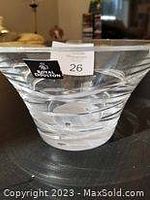 Close-up of the clear crystal bowl showing its shape and horizontal groove pattern, with Royal Doulton label visible.
