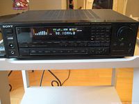 Front view of Sony STR-AV920 receiver powered on, showing radio tuned to 98.1 MHz.