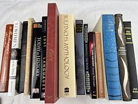 Row of assorted book spines showing titles and conditions