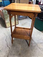 Photo of antique Eastlake maple side table showing overall structure and finish.