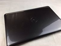 Closed laptop lid showing Dell logo and glossy finish with scratches