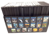 20 DVDs in black cases arranged in two rows with a display box showing mini previews of the movie covers.