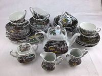 Full set of Myott 'The Hunter' vintage china including plates, cups, creamers, sugar bowl, teapot, platters, and serving bowl shown arranged together.