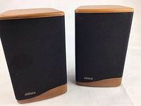 Pair of Mini Advent II wooden bookshelf speakers with black fabric grill on the front and solid wood caps and bases.