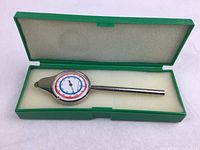Swiss opisometer in green case with foam lining showing dial and handle