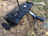 Overview of aerator body, tow hitch, and wheels