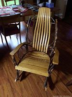 Front view of rocker showing full frame, seat and backrest