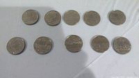 10 circulated Canadian 1 dollar coins front view, showing detail and condition