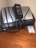 Fujitsu ScanSnap S500 colour image scanner with power adapter and cables on wooden surface