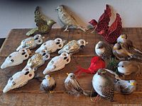 Full lot of 16 bird Christmas decorations on wooden table including owls, small birds, and metal birds