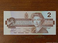 Front of the 1986 Canadian $2 bill showing Queen Elizabeth II and denomination