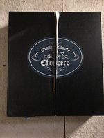 Closed black cabinet with Orange County Choppers logo on front