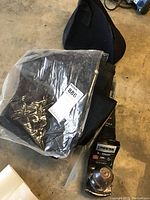 Overall view of the Reese Tow Power trailer hitch with a bag of felted totes placed on top.