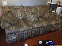 Full view of the patterned fabric Massoud sofa in a room setting.
