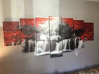 Seven-panel waterfall-themed canvas wall art depicting waterfall with red leaves and grayscale water and rocks.
