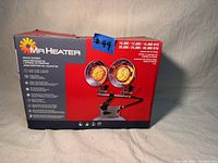 Closed box showing Mr Heater MH30T propane heater packaging with product image and features.