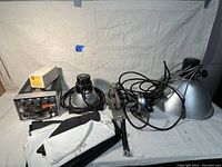 Full view of the Photogenic Flashmaster power pack, six attached flash heads with aluminum reflectors, white diffusion softboxes folded, and assorted cables and clamps.