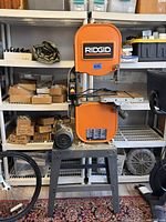Full front view of Ridgid BS14002 bandsaw on steel stand