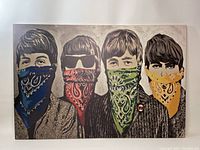 Front view of canvas showing grayscale Beatles band with colored bandanas (blue, red, green, yellow)