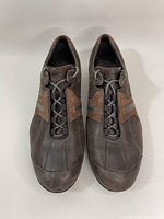 Top view of both brown men's shoes showing lace-up fronts and design details.