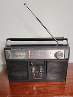 Front view of the Concertmate AM/FM stereo system showing overall body, speakers, and controls.