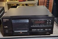 Front view of the black Pioneer PD-F507 compact disc player showing CD tray, control buttons and digital display.