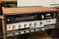 Front view of Fisher 401 showing wood side panels, tuning scale and control knobs