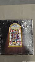 Close-up of The Alan Parsons Project vinyl record in shrink wrap with Best Buy sticker on front cover.