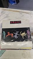 Top vinyl record by Heart with distinctive cover art featuring colorful stylized figures on black background in shrink wrap