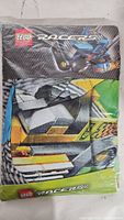 Front view of Lego Racers duvet cover in clear plastic packaging showing blue racer car graphics, Lego Racers branding