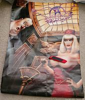 Full view of the Aerosmith poster showing the illustrated characters and logo with visible folds and some wear.