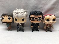 Front view of the four Funko Pop figures showing diversity in characters and detail