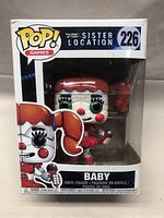 Front view of the Funko POP! figure box featuring BABY from Five Nights at Freddy's Sister Location with clear front window showing the figure inside, figure is fully visible, box has the number 226 and POP! Games logo.