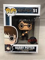 Front view of unopened Funko POP box showing Harry Potter figure holding Firebolt broomstick. Box labeled Harry Potter 51 with Special Edition sticker.