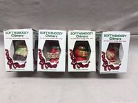 Four Soft'n Snoozy Chimers boxed porcelain figurines front view, showing packaging and visible figurines inside boxes.