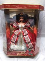 Full view of the 1997 Holiday Barbie doll in its original sealed box with festive packaging and collector's guide.