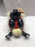 Front view of the OOglies Bump Along Cowboy toy showing large eyes, cowboy hat, and facial hair