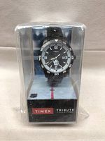 Front view of the sealed Timex Toronto Maple Leafs Tribute watch inside plastic packaging showing watch face with Toronto Maple Leafs logo.