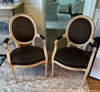 Pair of captain chairs shown together front-facing