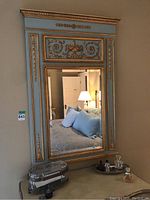 Full front view of entire mirror showing frame design and overall condition