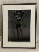 Framed black and white superimposed photo showing full front view of artwork featuring Brigitte Nielsen with visible shadows and silhouette effects.