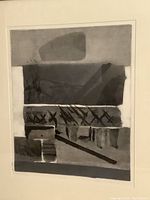 Close-up photo showing detailed abstract geometric shapes and markings in black and gray tones of the aquatint print.