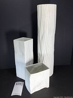 Three bisque textured Rosenthal Studio-Linie vases shown together, varying shapes and sizes
