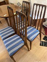 Four chairs grouped around table, showing overall style and finish