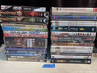 Stack of DVDs and 1 Blu-ray with visible titles including Star Trek, MacGyver, The Simpsons, and Columbo