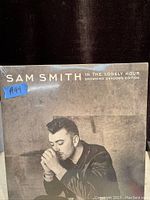 Front cover of the sealed double vinyl album showing a black and white photo of Sam Smith and the album title.