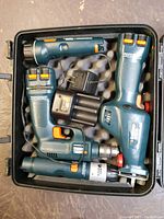 Set of three Black and Decker Versa Pack cordless power tools, battery charger and carrying case with foam padding