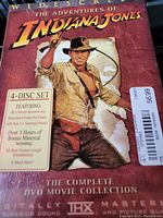 Close-up of the boxed Indiana Jones 4-Disc DVD set showing detailed text and cover art.