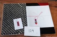 Box containing the wrapped Japanese fabric with label