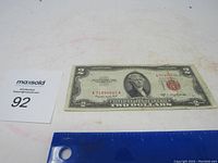 Front view of 1953 B $2 bill with red seal, showing serial number and condition.